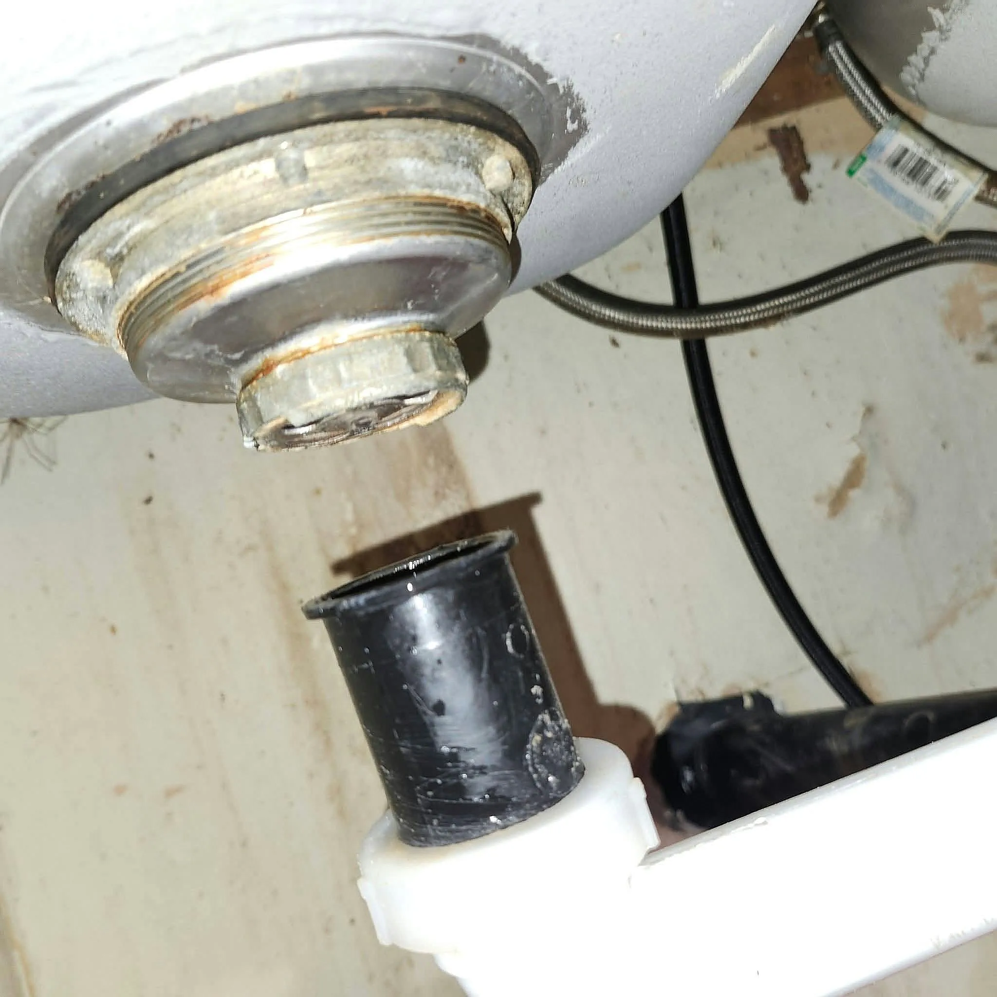 Garbage disposal drain connection under a sink