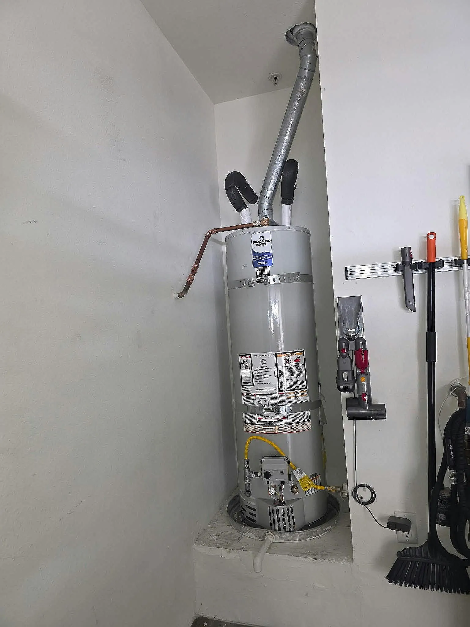 Newly installed gas water heater in a garage