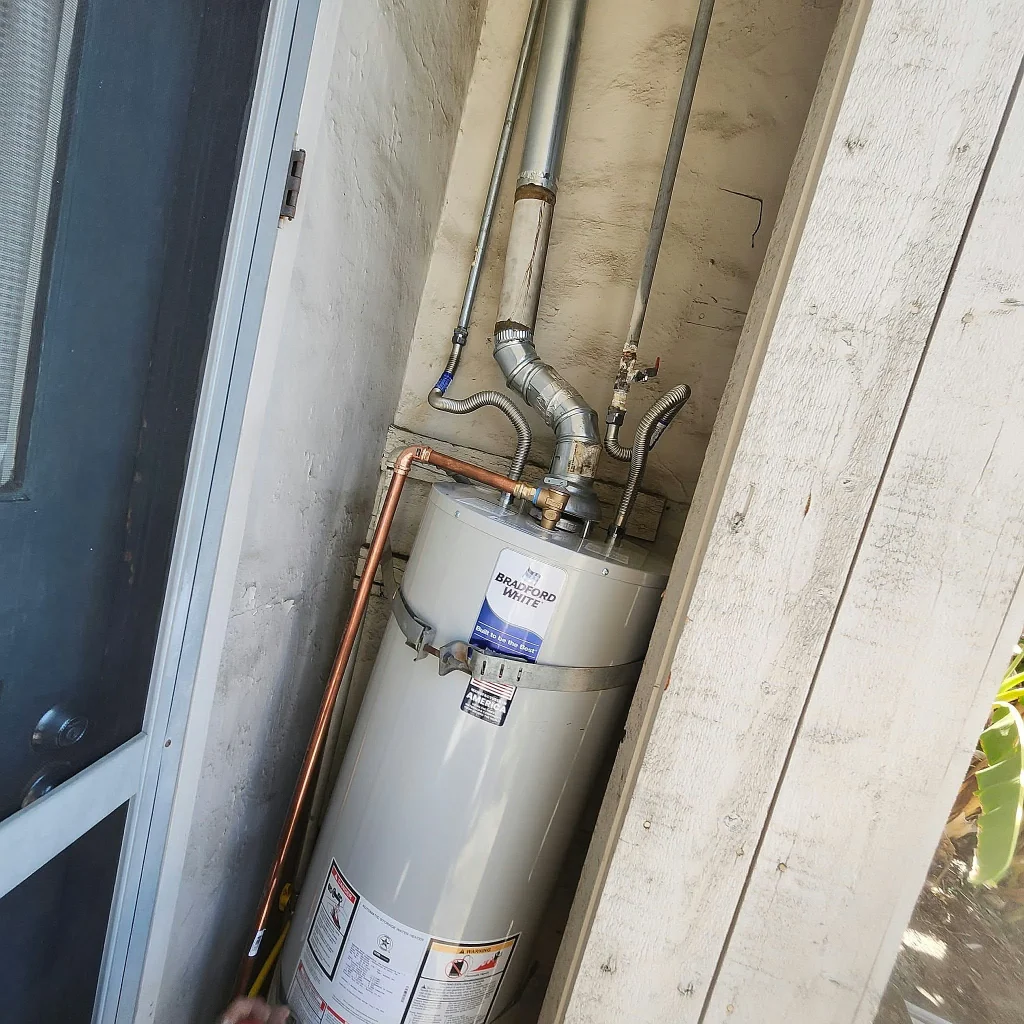Gas water heater with new copper connections in an exterior closet