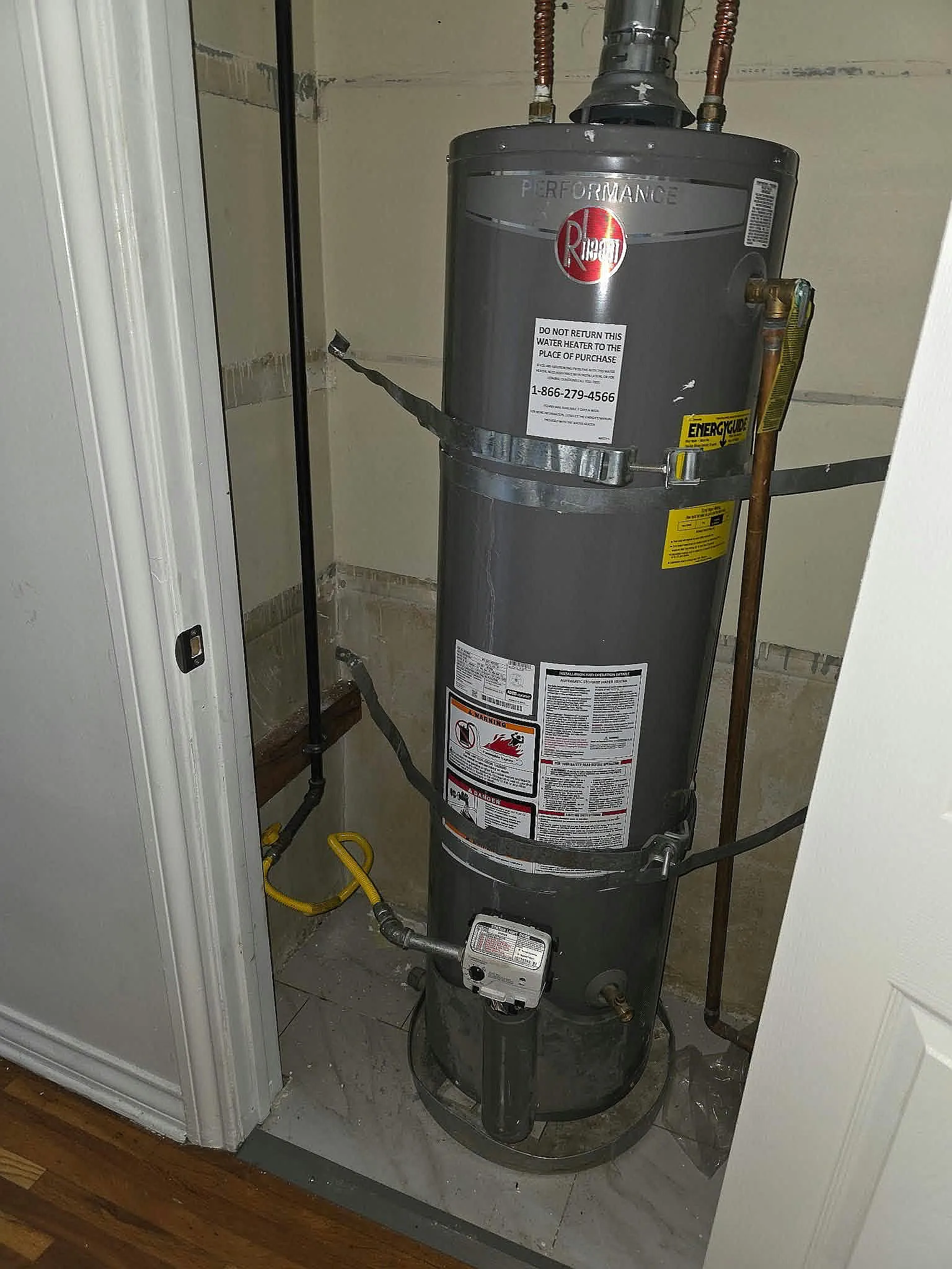 Gas water heater installed in a narrow closet