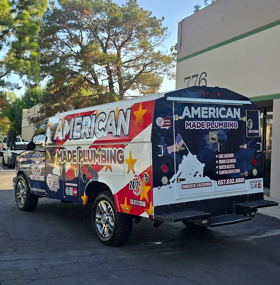 Rear doors of the wrapped American Made Plumbing service van